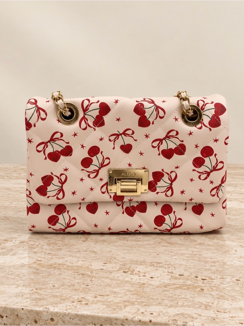 ALDO Quilted Cherry Print Crossbody Bag with Gold Handle and Chain Strap
